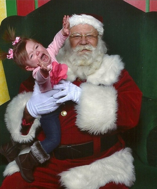 22 Kids Who Are Totally Over Taking Their Photo With Santa